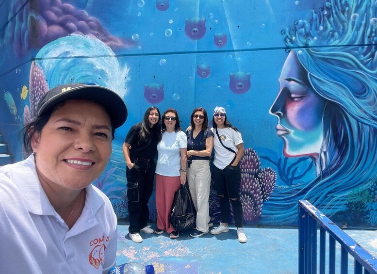 A mural with marine life and a woman's face. 5