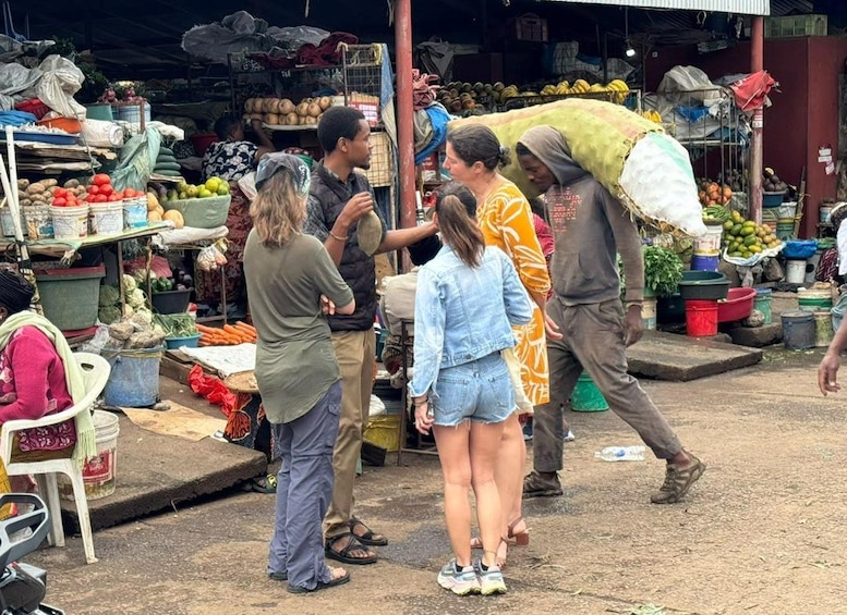 A bustling outdoor market with people shopping and vendors selling fruits and vegetables. 3