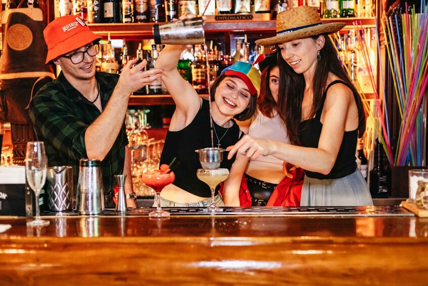 A bartender preparing drinks at a bar. 5
