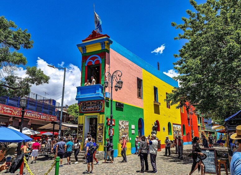 A colorful building with a sign for 'Cachafaz' and 'Camino'. 1