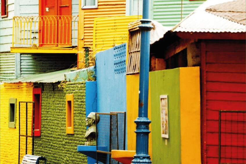 Colorful buildings with balconies and a blue street lamp. 3