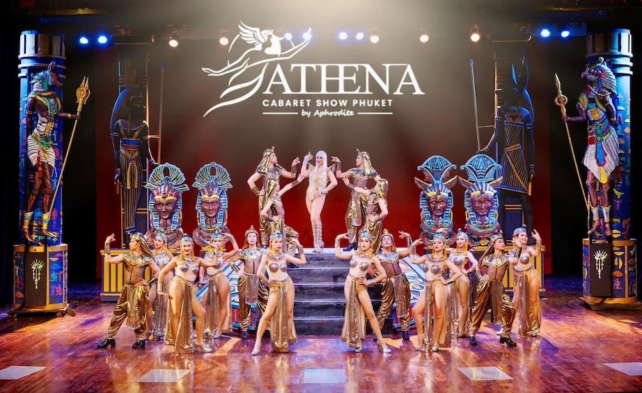 A stage with dancers in Egyptian costumes, a large sign reading "ATHENA CABARET SHOW PHUKET by Aphrodite", and Egyptian statues. 5
