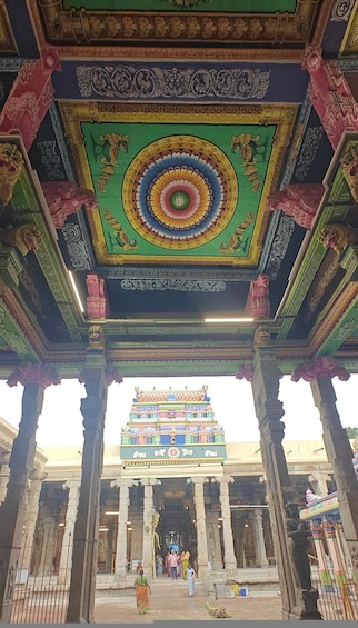 A temple with intricate carvings and a colorful ceiling. 3