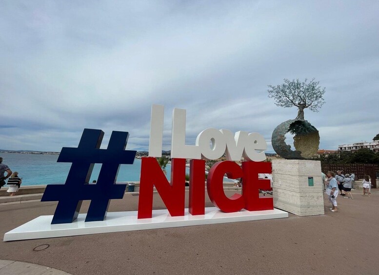 A large outdoor sign with the words "I Love Nice" and a hashtag symbol. 2