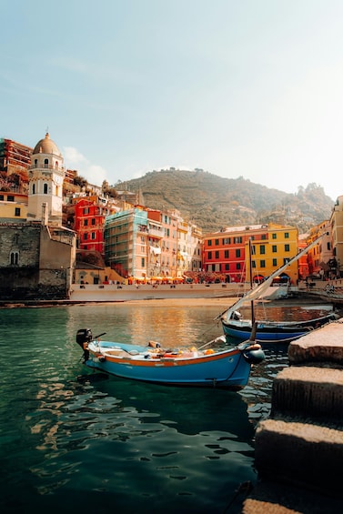 A coastal town with colorful buildings and boats docked at the harbor. 4