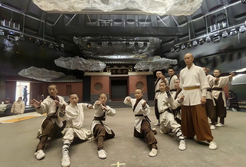 A martial arts class in a modern indoor setting with a traditional altar in the background. 2