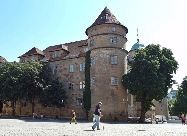 A historic building with a round tower and a dome. 1