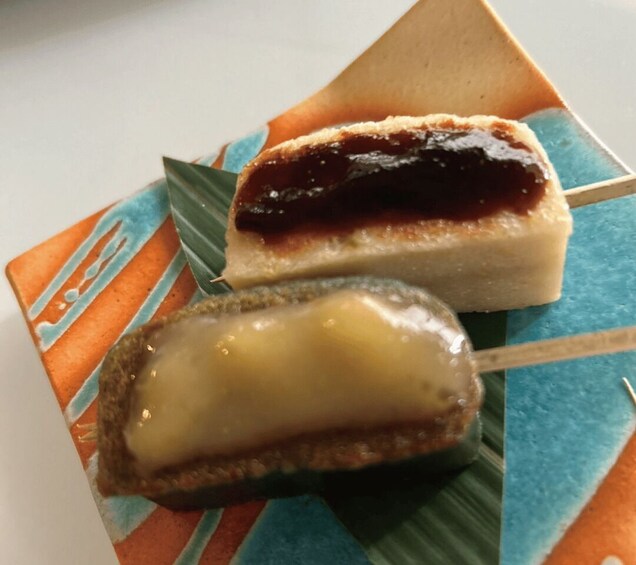 Two desserts on a colorful plate. 4