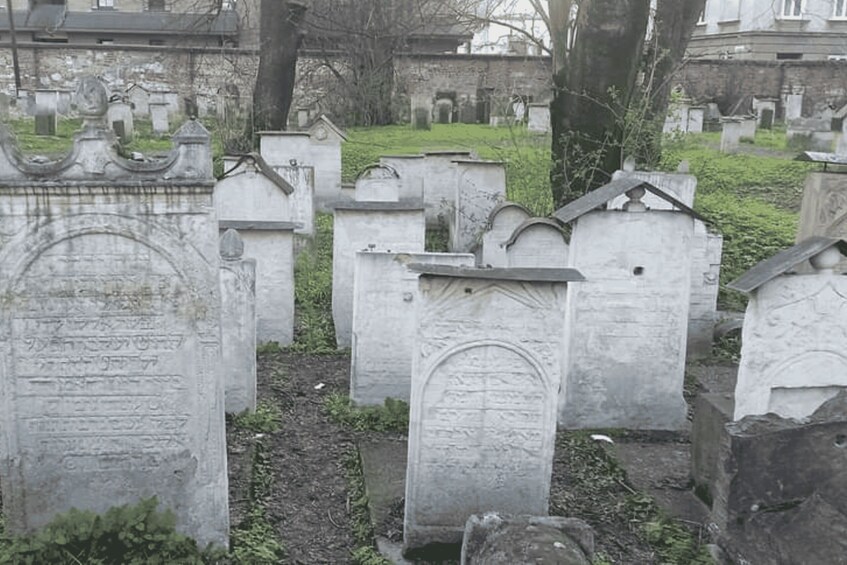 A cemetery with various tombstones and headstones. 3