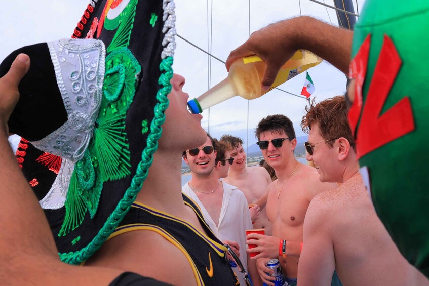 A person pouring a drink into a bottle. 1