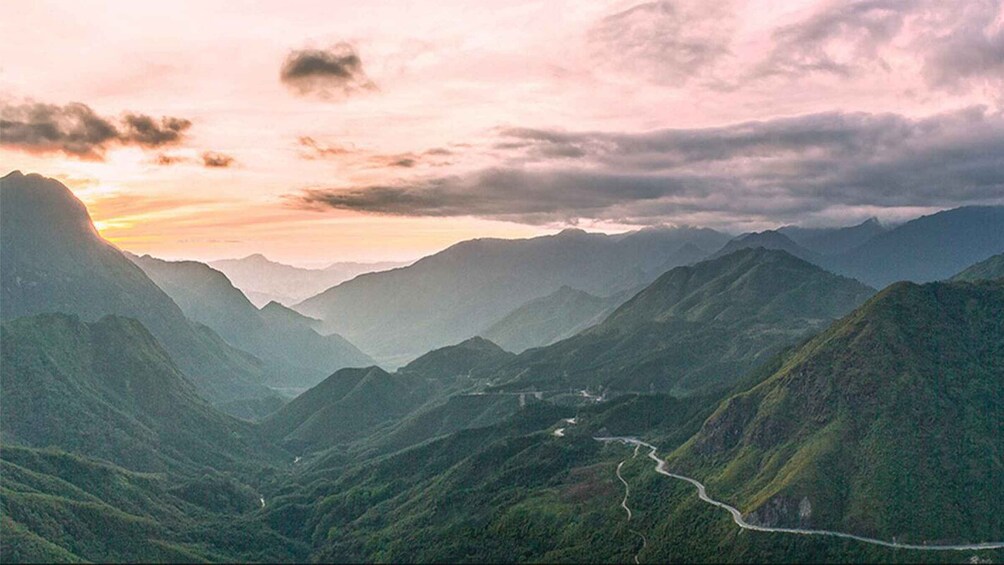 A mountainous landscape with a winding road. 3