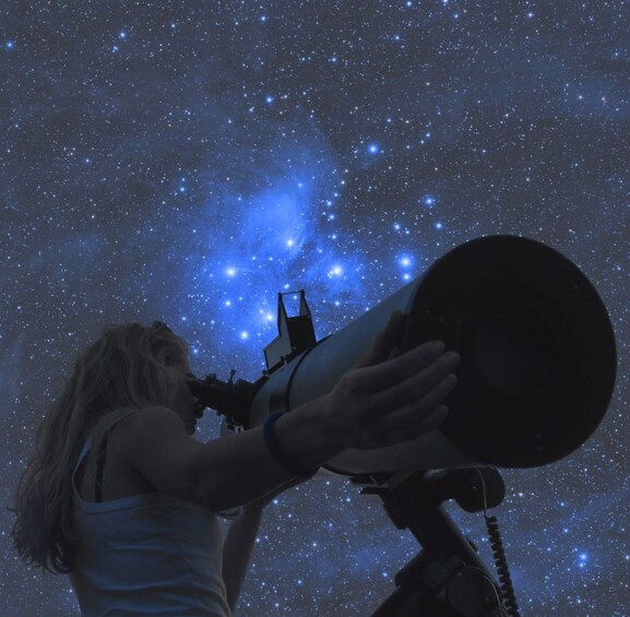A person using a telescope to observe a starry sky. 5