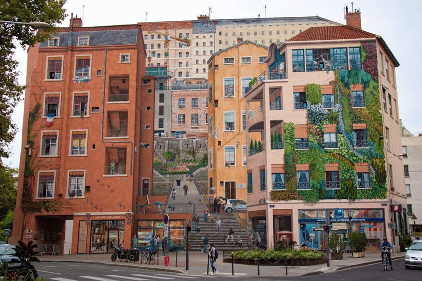 A multi-story building with a colorful mural on its facade. 3