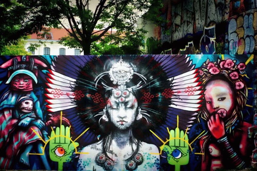 A colorful mural with various characters and symbols. 2