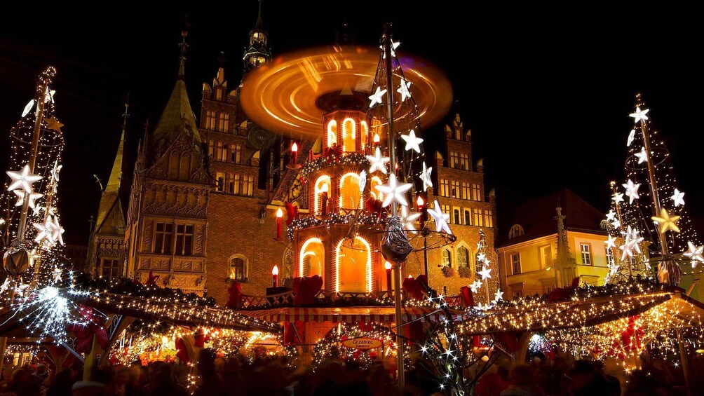 A historic building with a carousel, decorated with stars and lights. 3