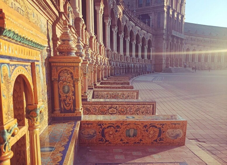 A grand architectural structure with ornate columns and detailed tile work. 1