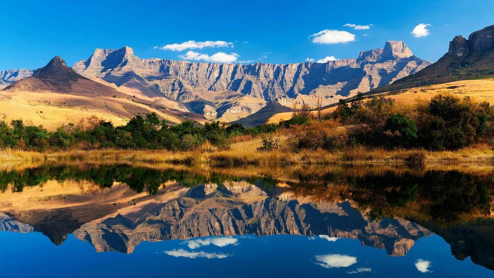 A mountainous landscape with a reflective lake. 4