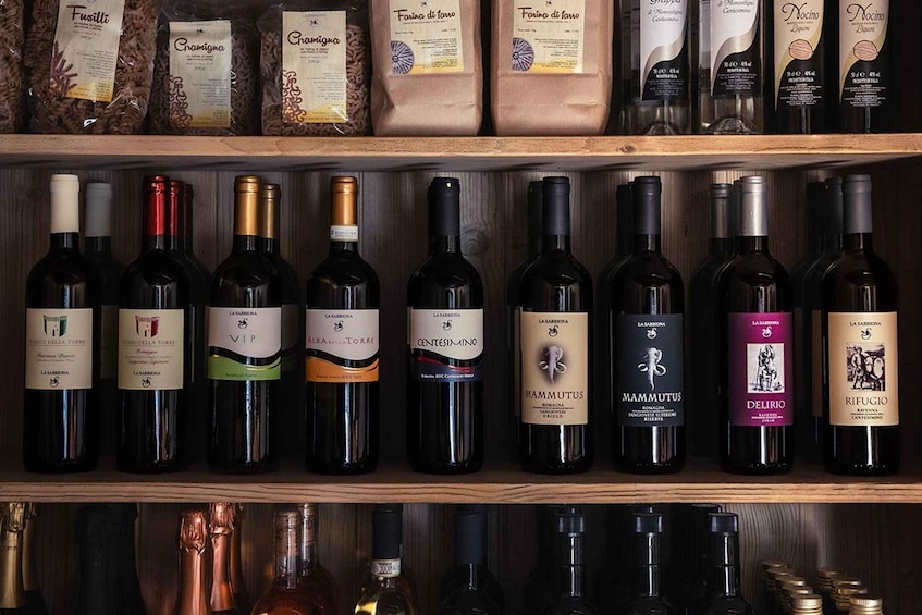 A wine rack with various bottles and packages of wine. 2