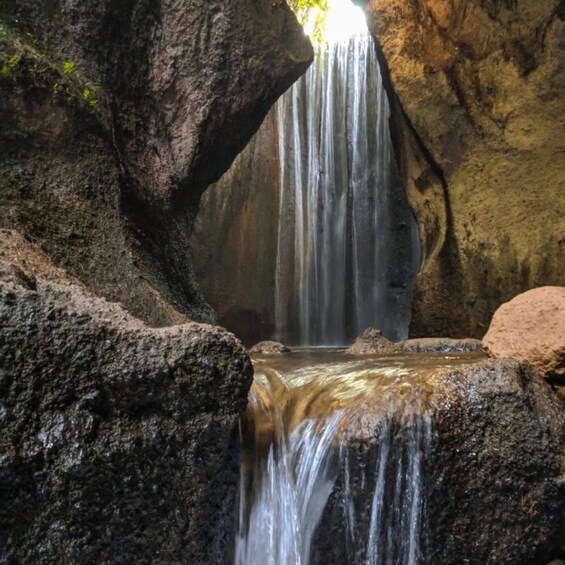 A waterfall cascading through a rocky gorge. 4