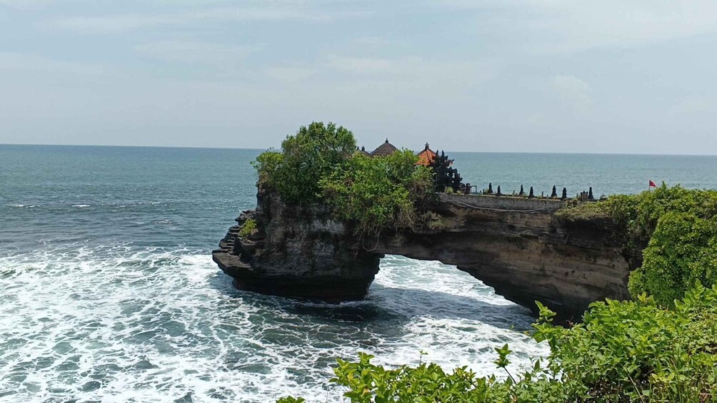A stone bridge over a rocky sea. 2