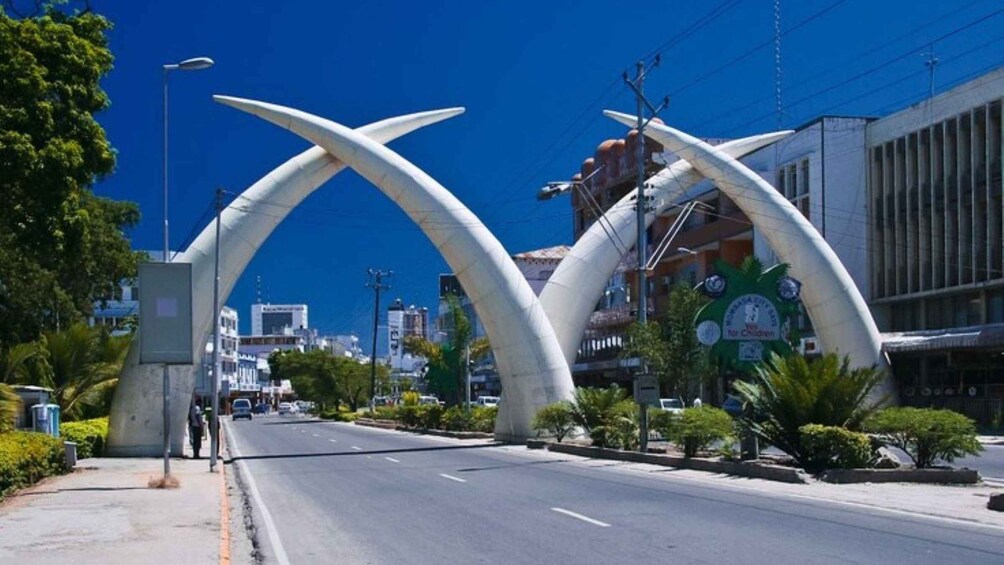 A city street with a distinctive archway structure. 1