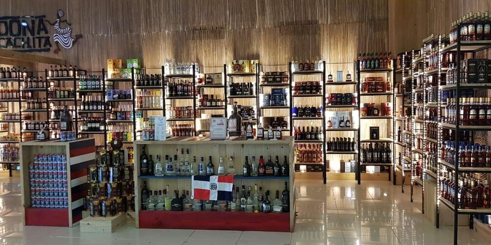 A liquor store with shelves stocked with various bottles and cans. 2
