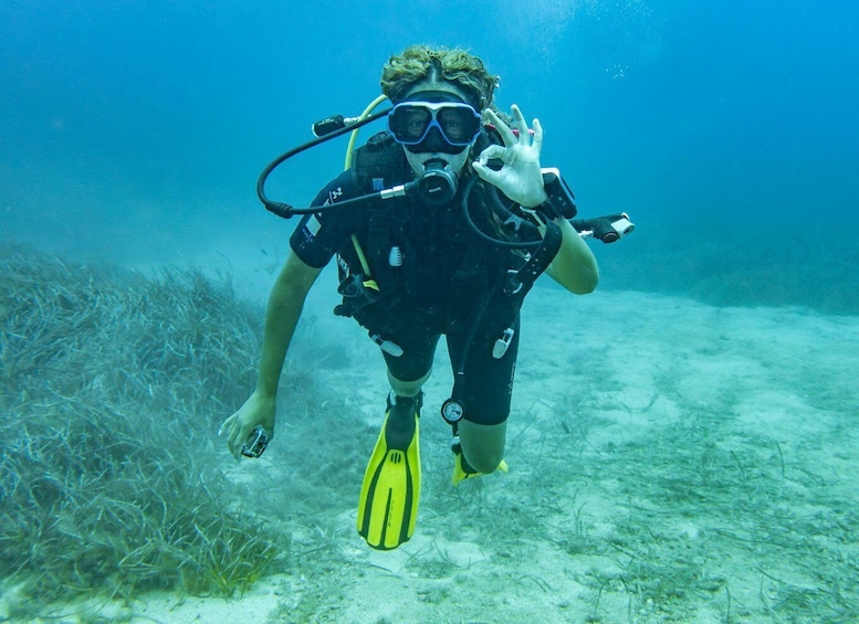 A person scuba diving underwater. 2