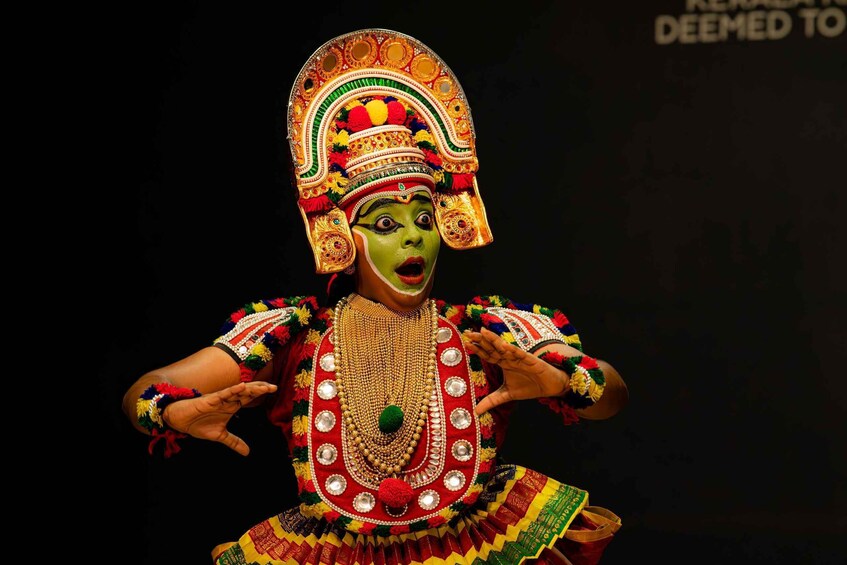 A person in traditional colorful attire with elaborate jewelry and a decorative headdress. 4