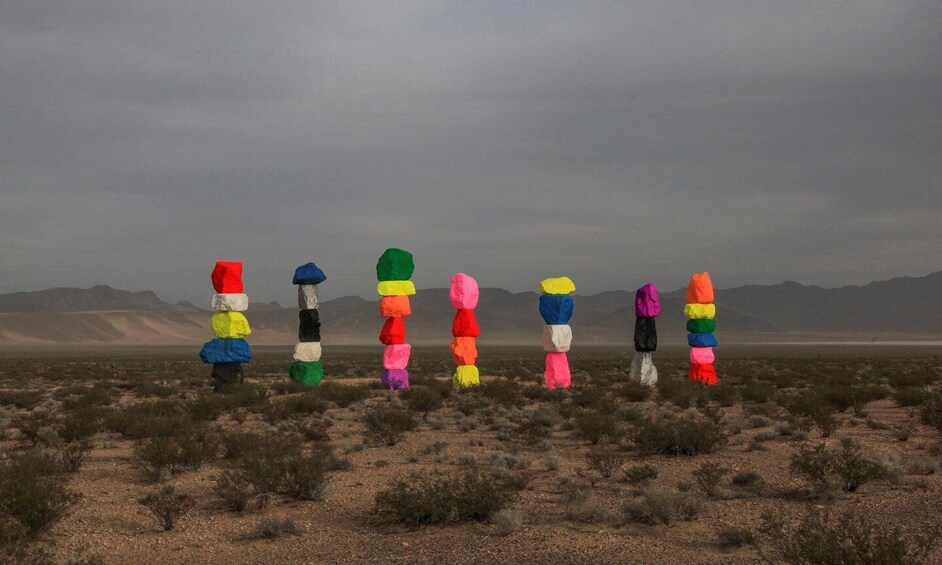 A desert landscape with colorful, stacked stone structures. 3