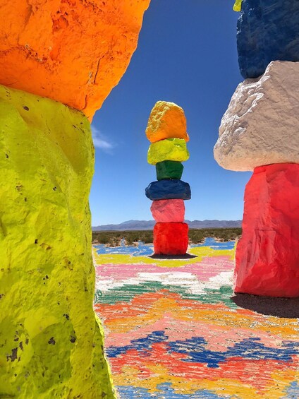 Colorful stacked rocks in a desert landscape. 2