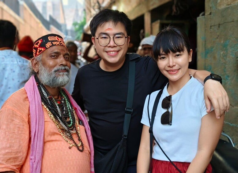 Three people standing together in an outdoor setting. 1