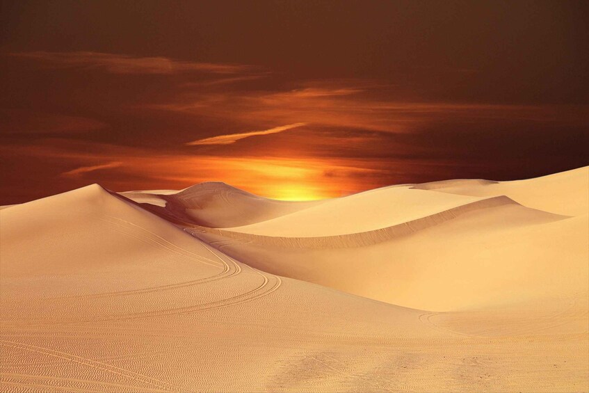 Sand dunes with a sunset in the background. 2