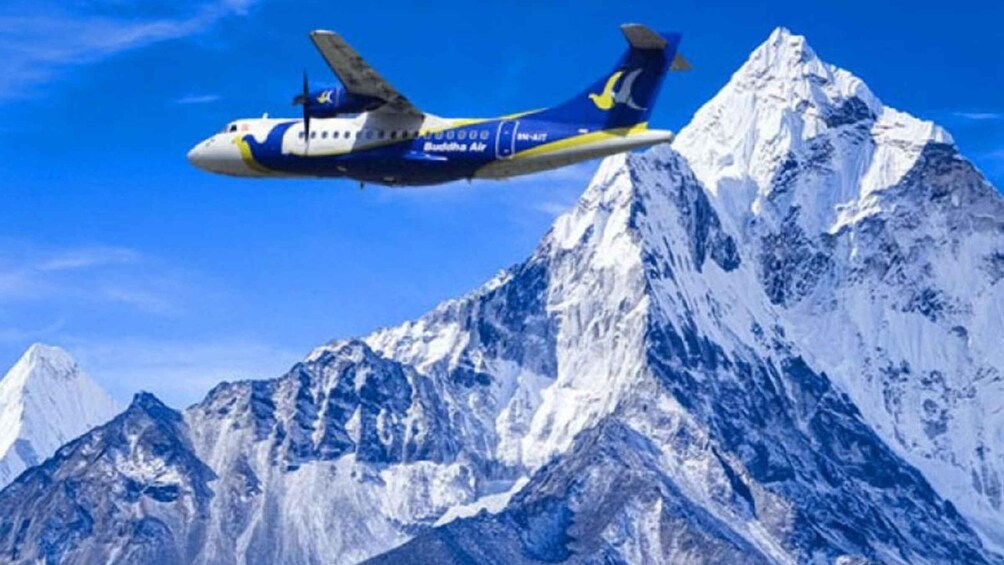 An airplane flying over a mountain range. 4