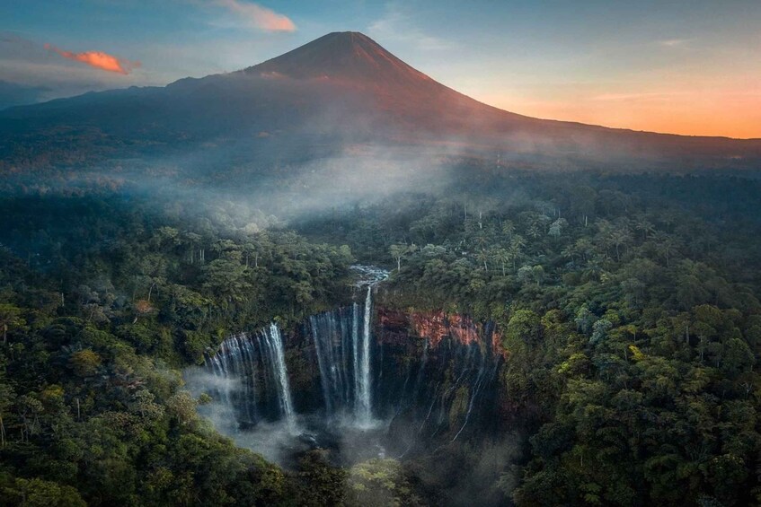 A mountain with a waterfall at its base. 5