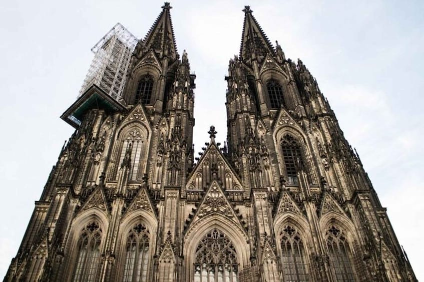 A Gothic cathedral with twin spires and intricate stonework. 1