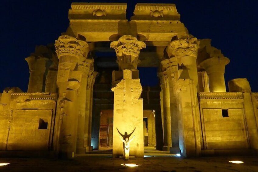 An ancient temple with large columns and a central doorway. 4