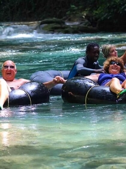 People floating on tubes in a river. 2