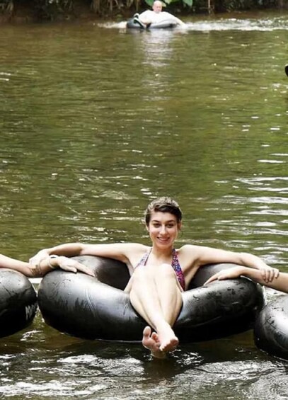A person floating on a raft in a river. 3