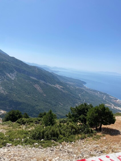 A mountainous landscape with a clear view of the coastline. 4