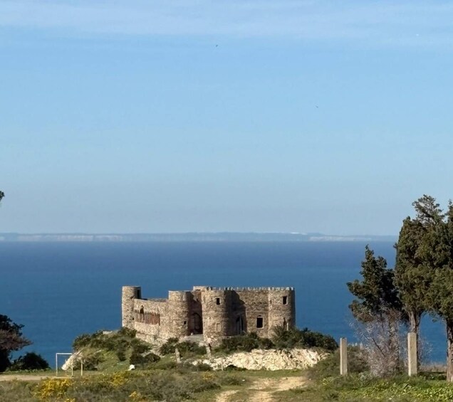 A coastal castle overlooking the sea. 5