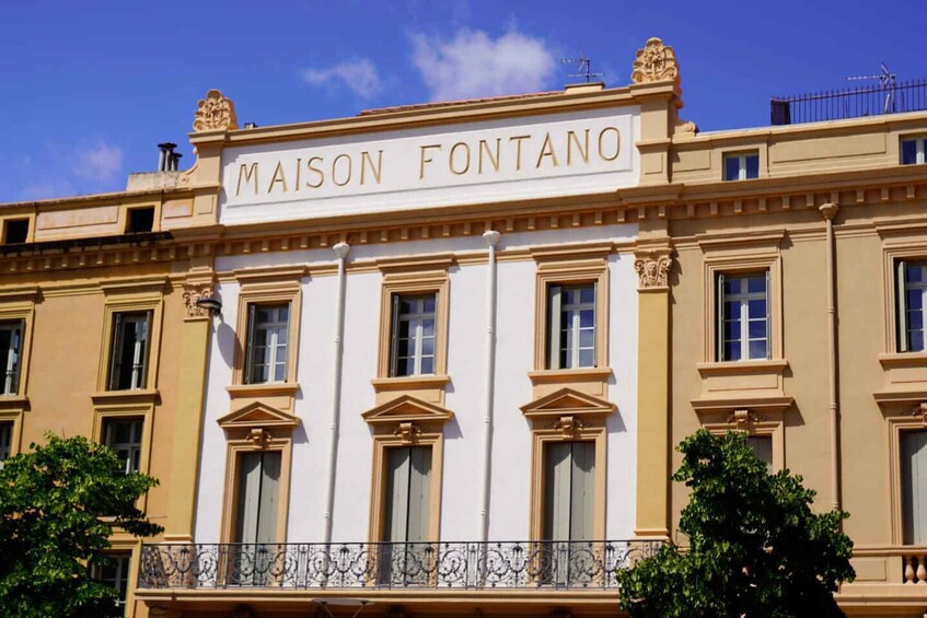 A building with the sign "MAISON FONTANO" on the facade. 5