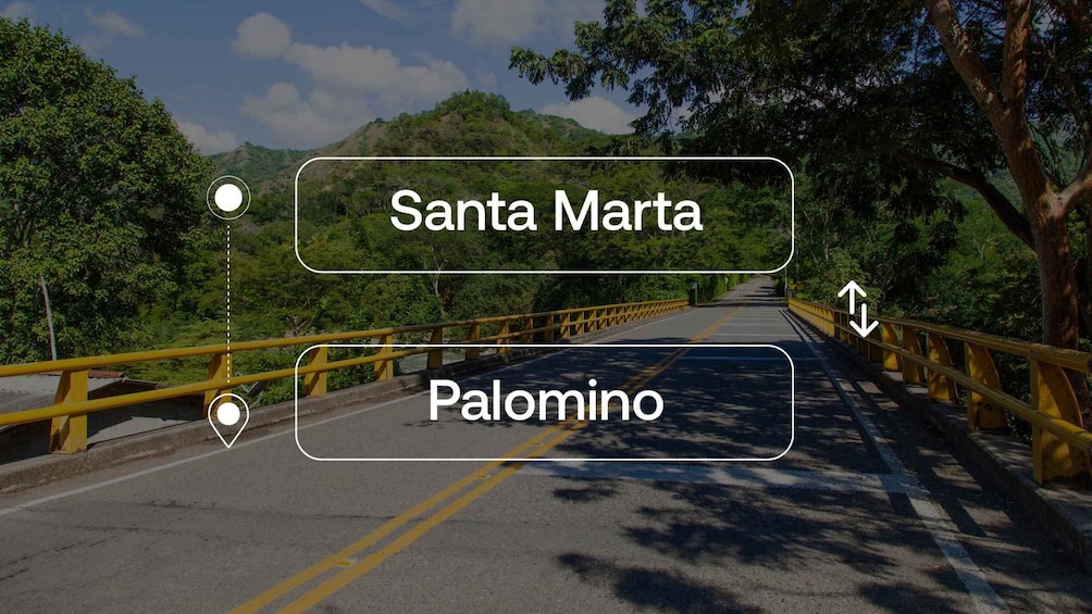 A bridge with yellow railings and a road leading to Santa Marta and Palomino. 1