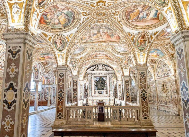 An ornate interior with detailed frescoes and a central altar. 4