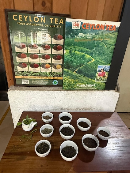 A display of Ceylon tea with a poster and a tea board. 2