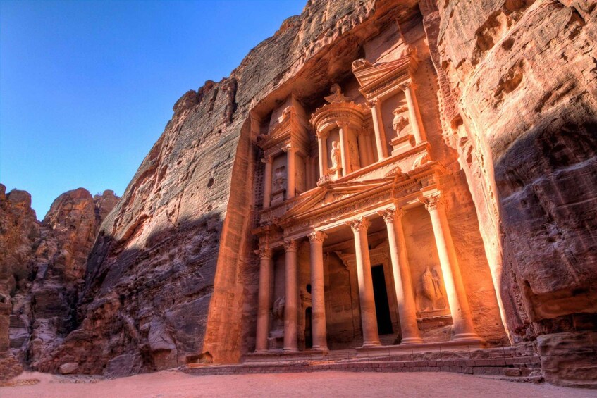 The Treasury (Al-Khazneh) in Petra, Jordan, featuring carved rock facades and columns. 3