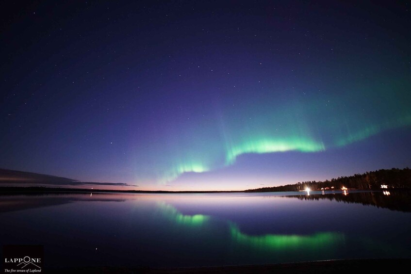 The Northern Lights over a calm lake at night. 1