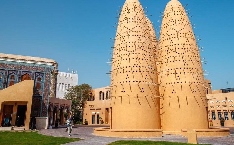 A large, unique building with a conical shape and numerous protruding elements. 2