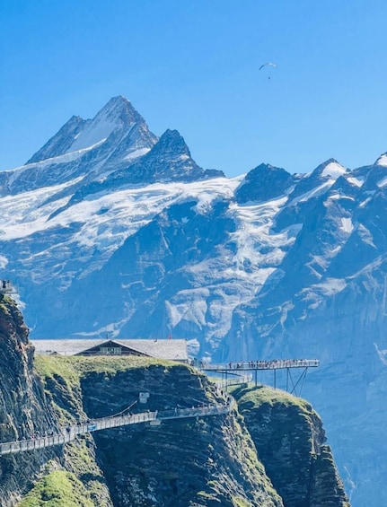 A mountain landscape with a glass bridge and a chalet. 1