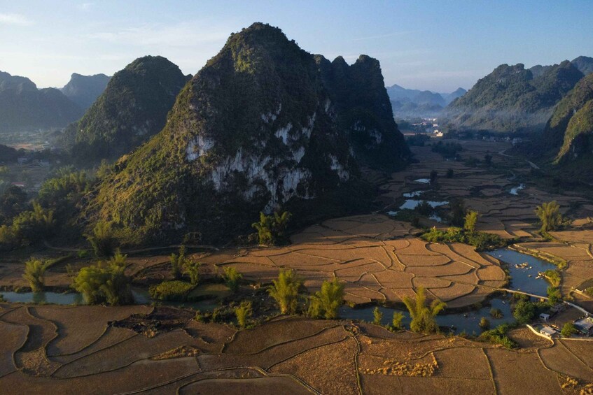 Terraced rice fields, a river, and a mountain range. 5