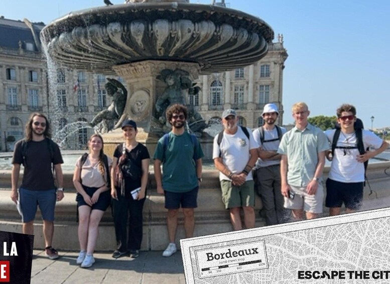 A group of people standing in front of a historic fountain with a building in the background. 4